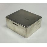A silver engine turned hinged top cigarette box. B