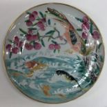 A Chinese plate attractively decorated with fish a