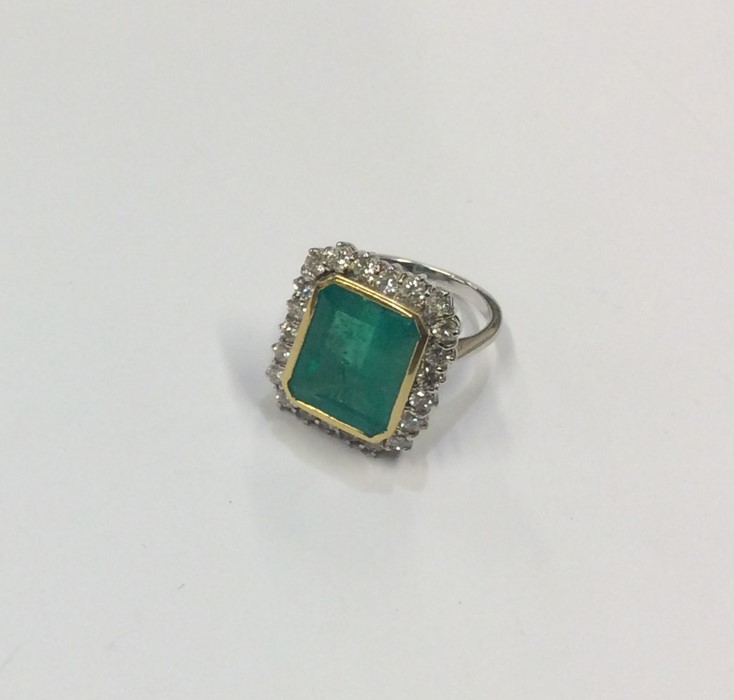 A massive rectangular emerald and diamond cluster