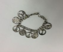 A heavy silver bracelet mounted with numerous char