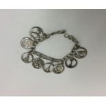 A heavy silver bracelet mounted with numerous char