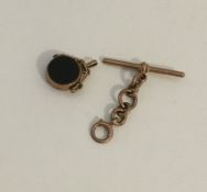 A small 9 carat spinning fob together with bar. Ap