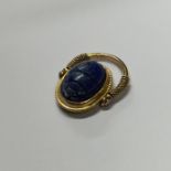 An unusual gold swivel ring in the form of a scara