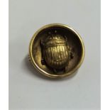 An Antique circular gold brooch mounted with a sca