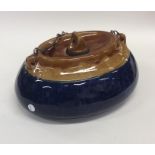 LANGLEY: A heavy glazed pottery bed warmer in blue