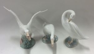 A group of three Lladro figures of geese. Est. £15