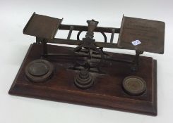 A set of oak mounted brass kitchen scales together