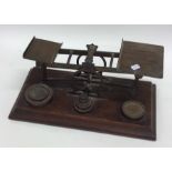 A set of oak mounted brass kitchen scales together