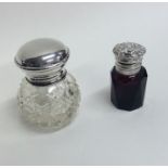 A small cranberry glass hinged top scent bottle to