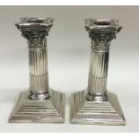 A good pair of Corinthian column silver candlestic