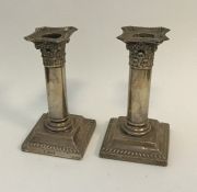 A pair of Edwardian Corinthian column silver candl