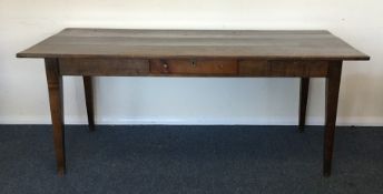 A good elm plank top farmhouse kitchen table on ta