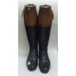 A good pair of leather mounted riding boots comple