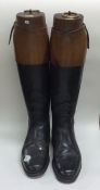 A good pair of leather mounted riding boots comple