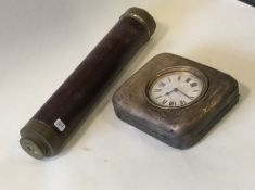 A silver mounted Goliath clock together with a bra