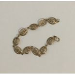 A 9 carat bracelet with Greek key pattern. Approx.