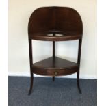 A Georgian mahogany corner wash stand with splayed