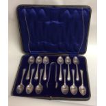 A boxed set of twelve OE pattern silver teaspoons