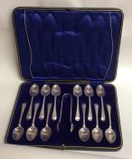 A boxed set of twelve OE pattern silver teaspoons