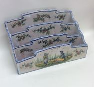 A French Quimper letter rack with blue ground deco