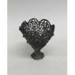 A silver filigree egg cup with ball decoration. Ap