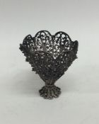 A silver filigree egg cup with ball decoration. Ap