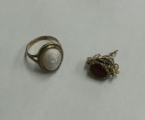 A 9 carat cameo ring together with a small triple