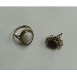 A 9 carat cameo ring together with a small triple