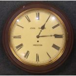 An oak wall clock with white enamel dial. By John