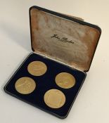 A boxed set of four silver gilt commemorative Wins