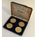 A boxed set of four silver gilt commemorative Wins