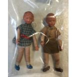 Two miniature vintage dressed German dolls; one a