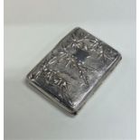 A Chinese silver cigarette case decorated with flo