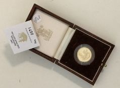 A 1997 Britannia £25 gold coin. Est. £180 - £220.