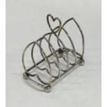 A small four bar silver toast rack / smartphone do