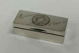 A heavy rectangular silver snuff box with coin dec