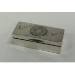 A heavy rectangular silver snuff box with coin dec