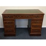 A reproduction mahogany twin pedestal desk with cr