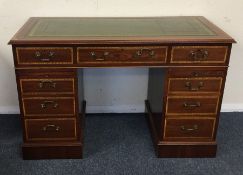 A reproduction mahogany twin pedestal desk with cr