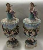 A pair of Continental 20th Century vases and cover