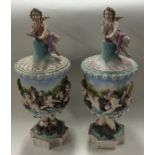 A pair of Continental 20th Century vases and cover