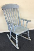 A blue painted rocking chair. Est. £30 - £50.