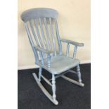 A blue painted rocking chair. Est. £30 - £50.