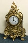 A massive reproduction brass mantle clock with whi