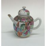 A small Canton teapot of typical design decorated