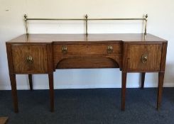 A massive Georgian mahogany sideboard with break f