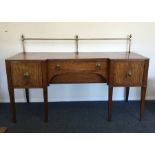 A massive Georgian mahogany sideboard with break f