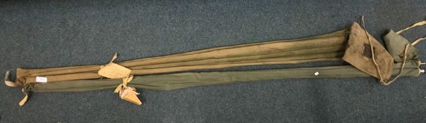 Two split cane fishing rods together with one othe