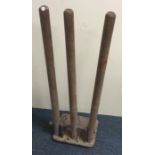 A novelty set of three cricket training stumps on