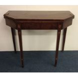 A Georgian mahogany card table with string inlay.